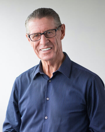 Happy Senior Man Wearing Glasses Smiling at Camera